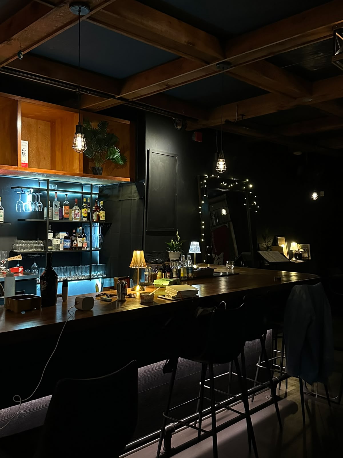 Muse dining counter beneath the warm wooden ceiling